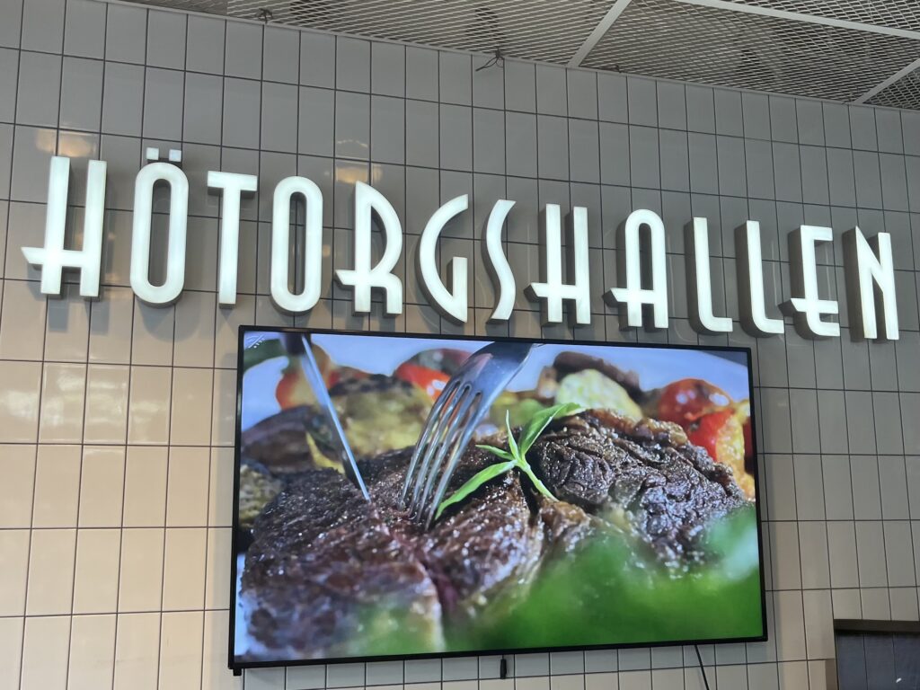 image shows the sign for Hötorgshallen food hall in Stockholm.