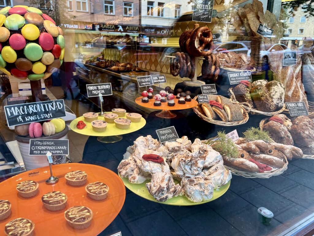 image shows cafe and bakery Gunnarson's display window full of desserts and treats