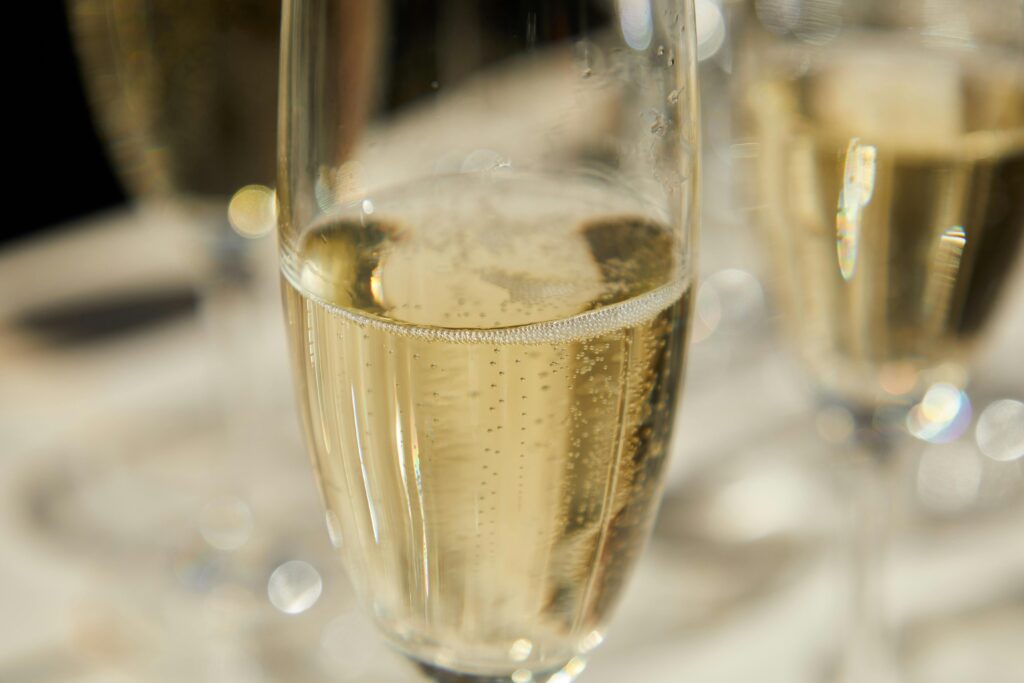 image shows a glass of Prosecco similar to ones you can drink at Mancini restaurant in Stockholm