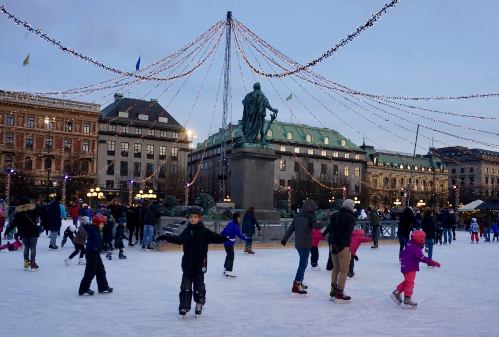 image shows people ice skating during winter in Stockholm
