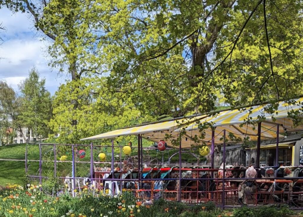 image shows outdoor garden restaurant in stockholm