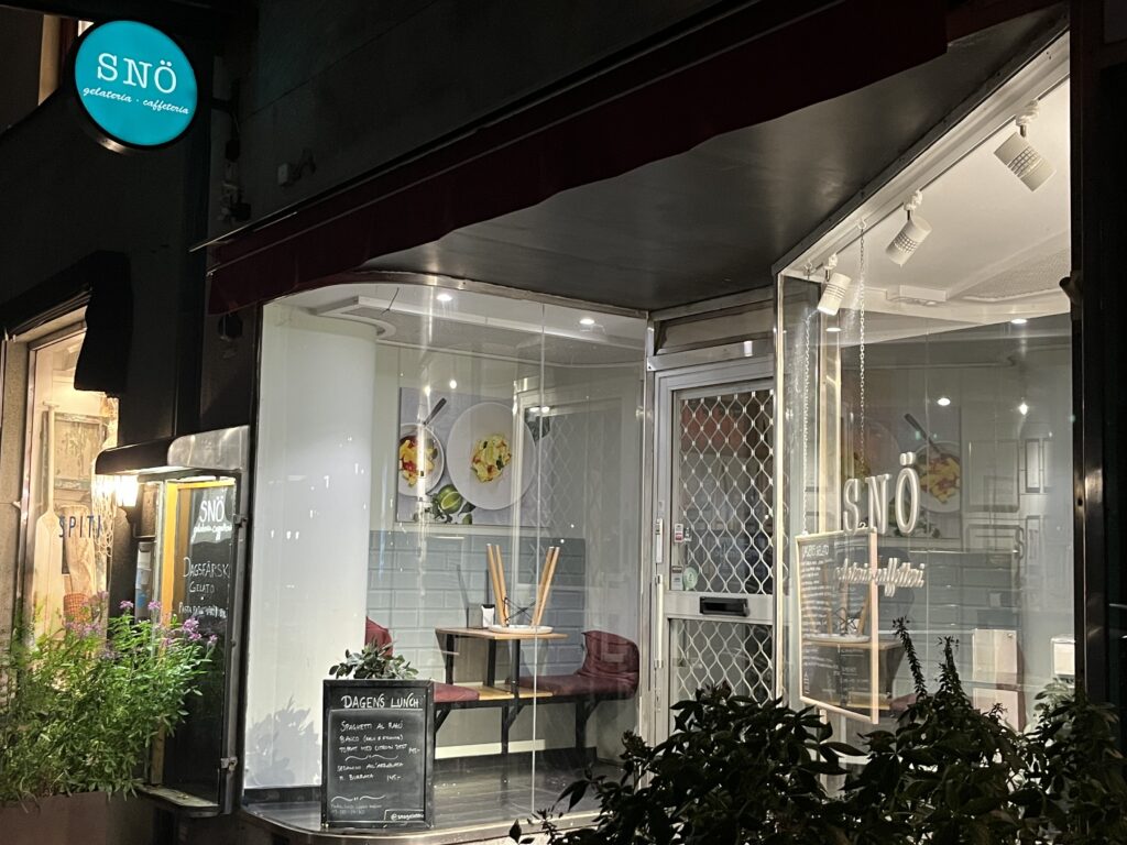 image shows the ouside of Sno ice cream dessert place in Stockholm at night